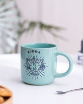 Turquoise Libra zodiac mug with astrological sign illustration, a unique and personalized touch for astrology enthusiasts.
