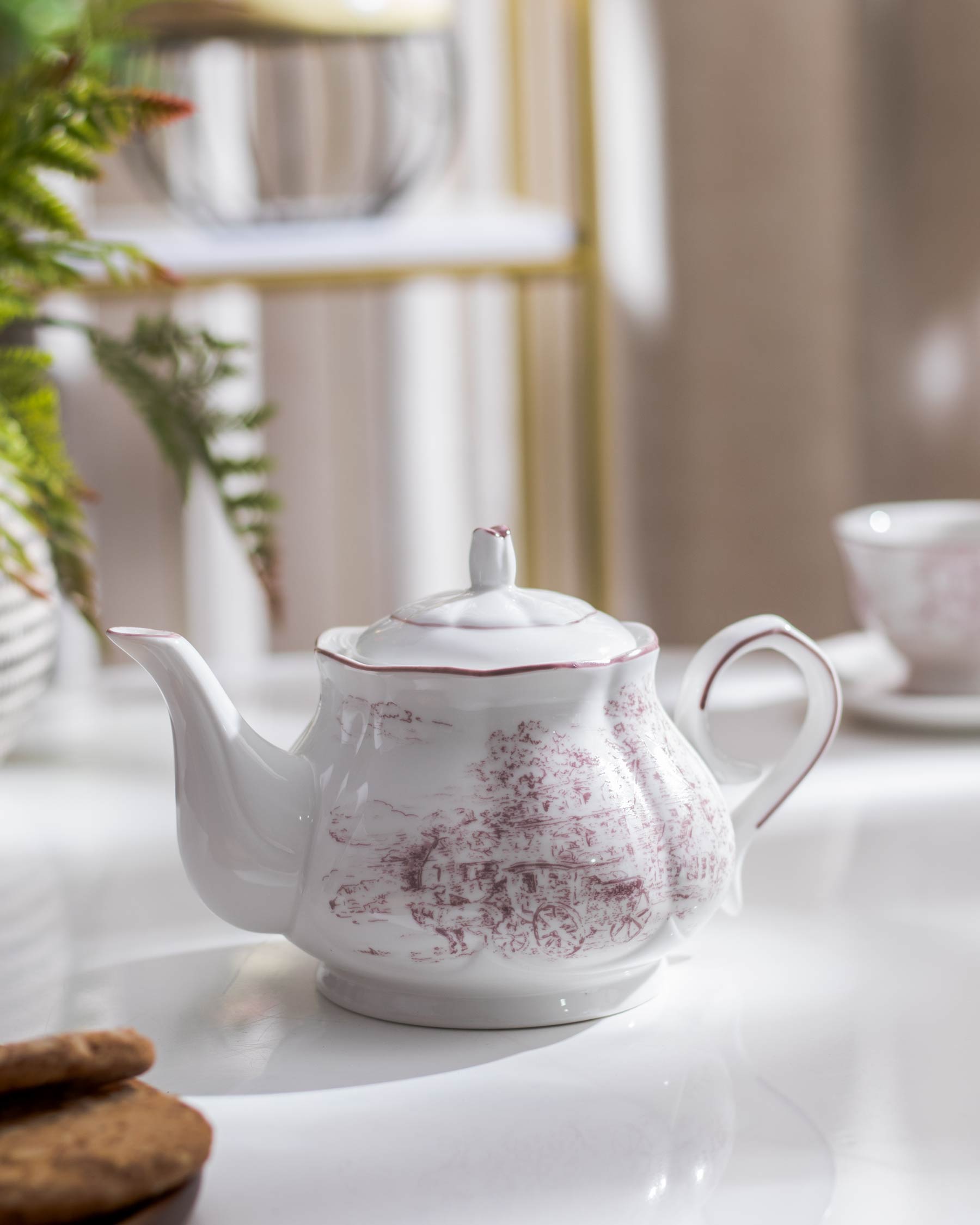 Elegant Hampshire Ceramic Tea Kettle featuring a floral Baroque pattern, close-up view on kitchen counter.