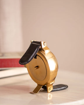 Compact and luxurious leather handle table clock, perfect for a desk or mantelpiece.